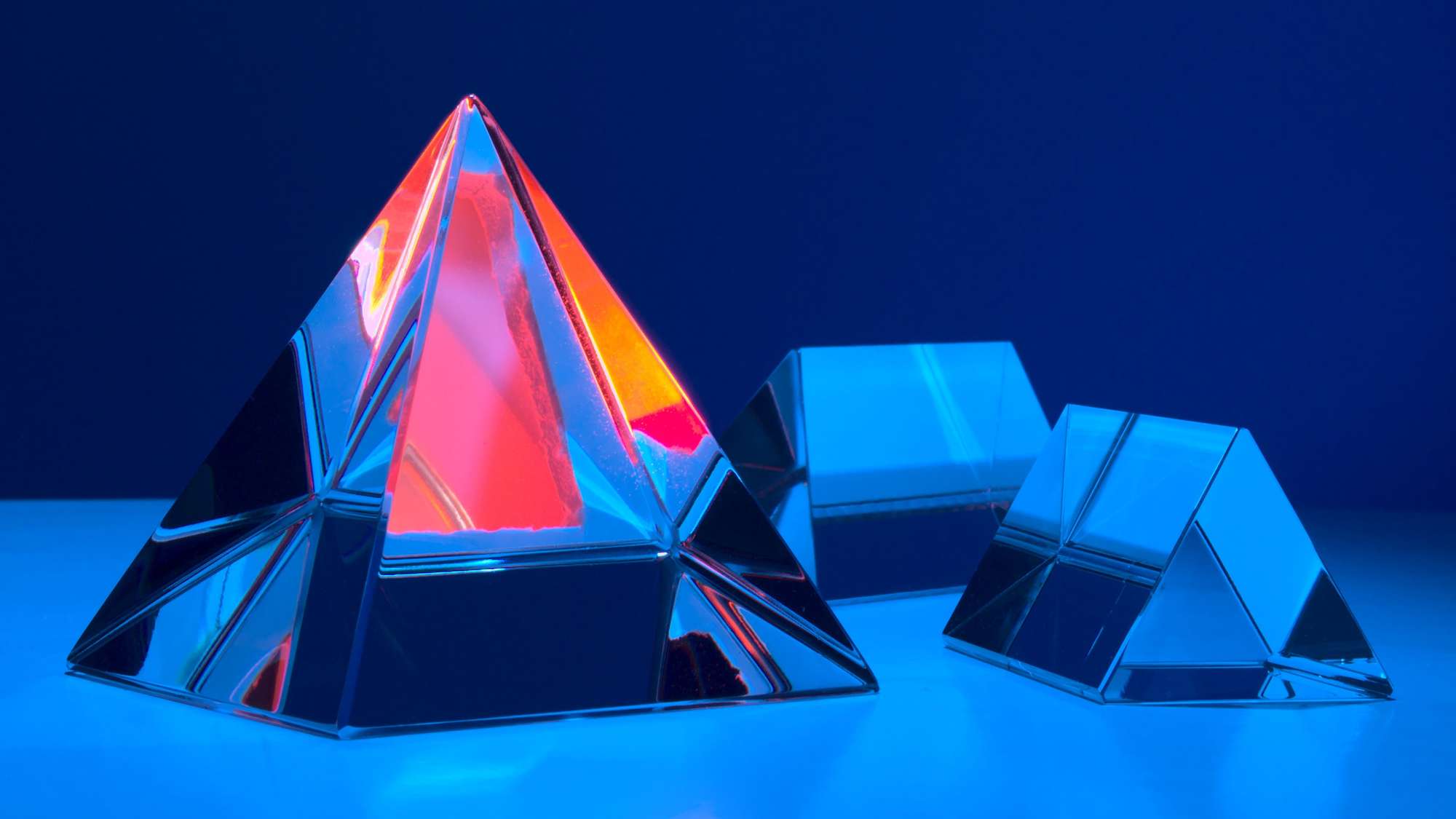 Crystal pyramid shot in studio with colored flashes
